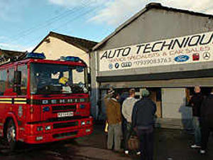 Supporting image for story: Blazes destroy car site and unit