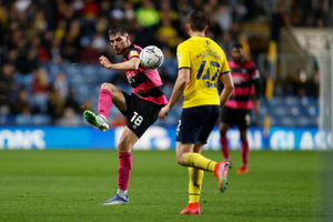 Tom Bloxham of Shrewsbury Town and Steve Seddon of Oxford United (AMA)