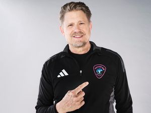Peter Schmeichel poses for photos in his Soccer Aid top