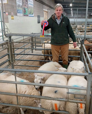 Philip Dudleston with his champion pen of Beltex cross Texel lambs.