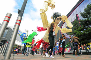 Local hero The Tipton Slasher gets ready for the giant puppet parade in West Bromwich as part of the Sandwell Arts Festival
