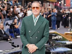 Supporting image for story: Brad Pitt gets behind the wheel of a real F1 car as his movie hits cinemas