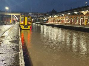 Supporting image for story: Heavy rain brings travel disruption with cars stranded and trains suspended