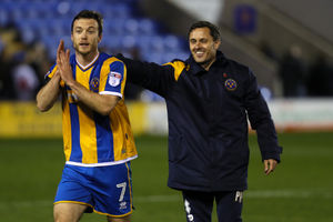 Shaun Whalley is congratulated by the boss after netting in the 98th minute to help secure a first league win at home (AMA)