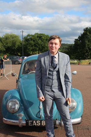 Charlie Milner arriving in a vintage VW Beetle