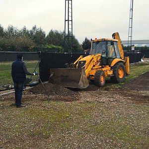 A JCB digger clears space for fans at Noose Lane