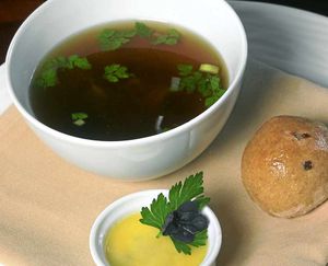 Clear as crystal  rabbit consommé served with dense onion bread