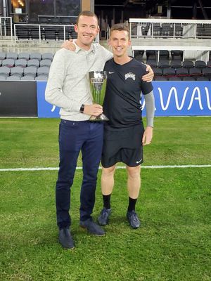 Neill Collins and Kevin Foley with the United Soccer League Eastern Conference trophy