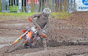 Muddy marvel: August Frisk makes his way through the boddy conditions at the Hawkstone Park International