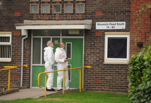 Forensics officers at the flats in Willenhall where Mr Shepperson was found dead