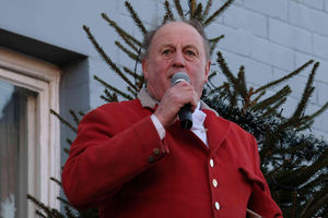 Robert Jones, senior joint master of the Radnor and West Hereford Hunt speaks to the crowds in Kington town centre. Image by Andy Compton