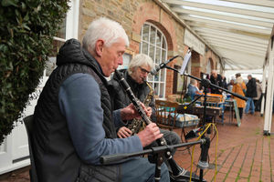 Bill Laws and Karlin Ruhbrooke of Street Sax played their music as shoppers browsed and purchased goods. Image by Andy Compton