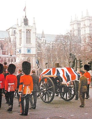 Household Division guardsmen escort a gun carriage carrying a coffin draped in the Union flag towards Westminster Abbey during rehearsal for the ceremonial procession of Queen Elizabeth the Queen Mother’s coffin from the Queen’s Chapel at St James’s Palace to Westminster Hall