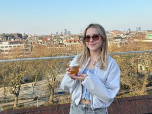 Charlotte Toller holding a pint of beer