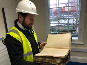 Supporting image for story: 100-year-old documents discovered in forgotten safe during bank restoration