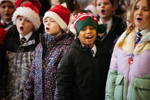 Year Three and Year Four pupils from Lawley Village Academy singing carols for care home residents