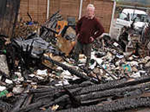 Supporting image for story: Activists blamed for blaze and car damage