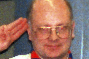 Allan Richards saluting during his time as a Scout leader