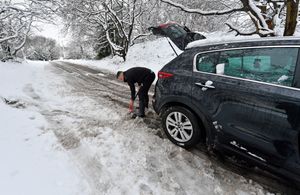 The scene around Aldridge after heavy snowfall.Trying to free a car.