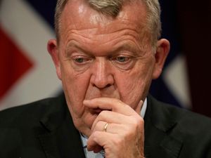 Danish foreign minister Lars Lokke Rasmussen listens to speakers during a meeting