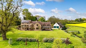 The property features secondary accommodation above the garage. The Mill has been listed for £1.35 million. Picture: Rightmove/Knight Frank. 