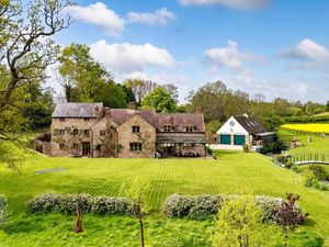 The property features secondary accommodation above the garage. The Mill has been listed for £1.35 million. Picture: Rightmove/Knight Frank. 