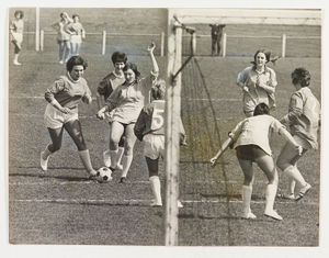 Women from the Dudley and West Bromwich branches of Marks & Spencer stores played each other at football to raise money for charity. Joyce Edwards and Liz Pearson are mentioned. April 29, 1971