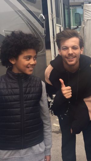 Telford model Luca Drummond, 10, hangs out with 1D star Louis Tomlinson on the set