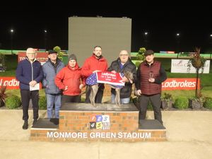 Clona Stand on the winner's podium with Nathan Hunt and members of the Nathan Hunt Racing Club