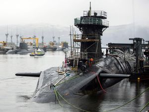 Vanguard-class submarine HMS Vigilant (front right), one of the UK’s four nuclear warhead-carrying submarines, with Astute-class submarines HMS Artful (back left) and HMS Astute (back 2nd left) at HM Naval Base Clyde, also known as Faslane