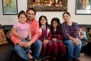 Aditi and Anisha with dad Anand, mum Kasturi and two-year-old sister Anushka