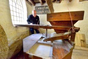 Mr Bassett with the mill wheel