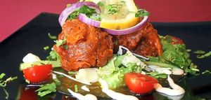 Starting out – the onion bhaji on a bed of crisp salad