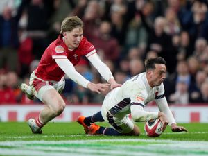 Alex Mitchell dives over the line to score a try