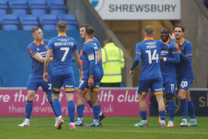 Dan Udoh of Shrewsbury Town celebrates with his team mates after scoring a goal to make it 1-1 (AMA)