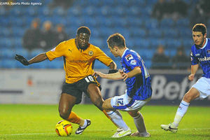 Bakary Sako of Wolverhampton Wanderers and Paul Thirlwell of Carlisle United.