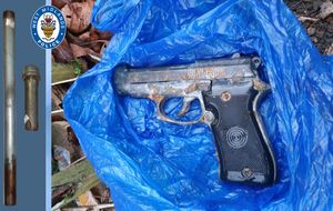 The slam gun, left, and handgun recovered by officers
