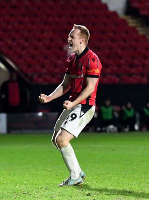 Danny Johnson celebrates scoring from the spot in Walsall's shoot-out win over Reading last season.