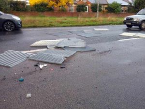 Supporting image for story: Lucky escape for driver as metal sheets fall off lorry onto car on the A5