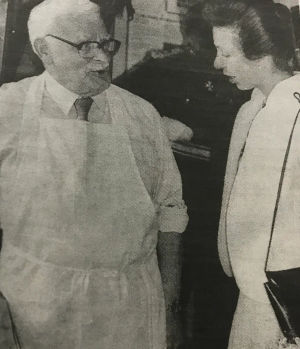 The Princess Royal talks to Frank Egan, who demonstrated the craft of edging leather on 10 June 1988