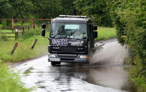 A lorry makes a splash on Radford Lane, west of Wolverhampton