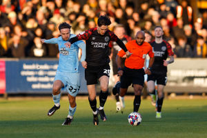 Tom Bayliss of Shrewsbury Town and Ben Worman of Cambridge United (AMA)