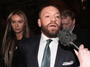 Mixed martial arts fighter Conor McGregor and partner Dee Devlin leaving the High Court in Dublin