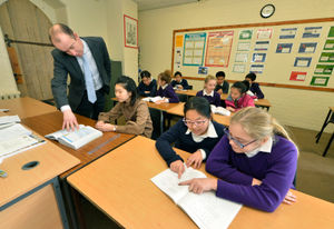Julia Smith and Sandy Wong, both aged 11 in a maths lesson