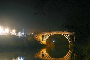 A stunning photograph of The Iron Bridge captured at night by Neil