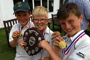 Cannock under-nines players Daniel Ranford, Jake Cope and Jamie Youll with the trophy.