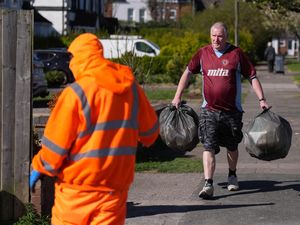 Local residents delivering rubbish to mobile collection vehicles in Erdington, Birmingham