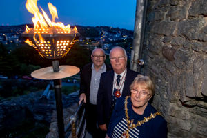 Queen's Jubilee beacon lighting at Dudley Zoo..Mayor of Dudley Cllr Sue Greenaway lights the beacon with Zoo Director Derek Grove and Deputy Lieutenant Nick Venning.