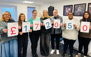 EDGE Creative team members celebrate the total raised for Birmingham Hospice in 2025.