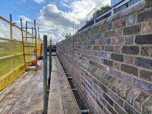 Supporting image for story: Town votes for a 25-year loan to pay for wall costs